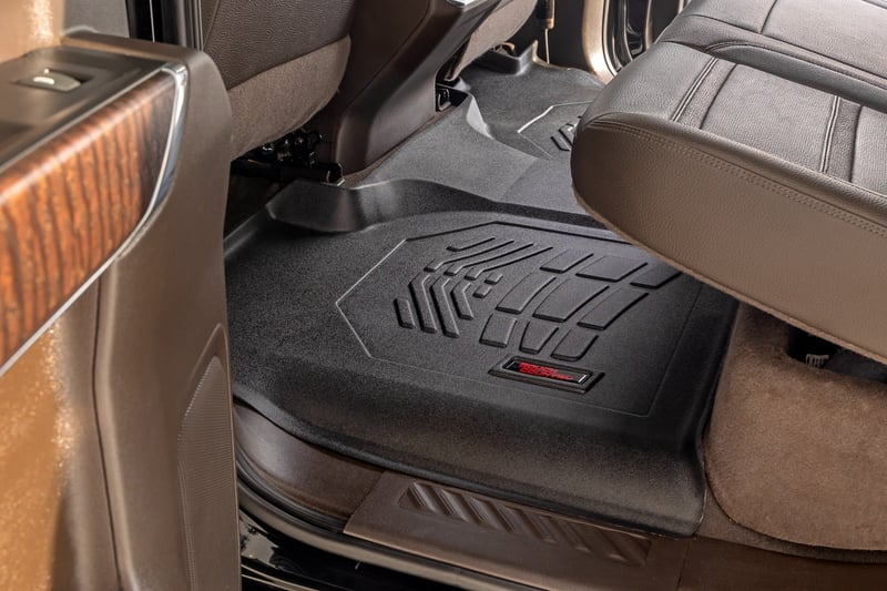 RC Sure-Fit Floor Mats | Front Over Hump | Crew | Chevy/GMC 1500/2500HD/3500HD (19-26) (manufacturer page)