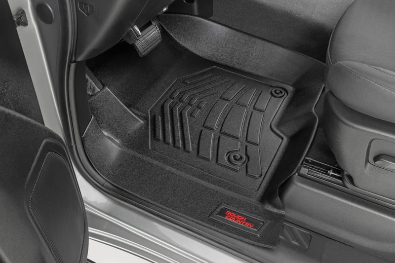 RC Sure-Fit Floor Mats | Front Over Hump | Crew | Chevy/GMC 1500/2500HD/3500HD (19-26) (manufacturer page)